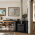 Large sliding doors separate the main living area on the left from the studio on the right