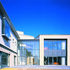 Finished in render, timber, glass and reconstituted stone