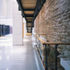 Concrete columns in the exhibition space support a multi-faith room