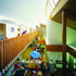 Visitors entering the school can look over the  gallery into the ‘street’  below which acts as an informal play area with a library and other shared spaces