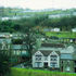 The school can just be discerned tucked into the hillside among the terraces