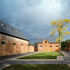 Central court, flooded stable to left, children