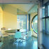 Dining area with splayed wall and sculpture by Simon Stringer