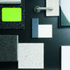 Materials board, including bespoke carpet, stainless steel handrail and handle, lime paint, textured paving, polished black blockwork and textured silver blockwork