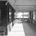 View of the conference area at western end. The south facing windows are lined with work counters inside, which have an oak and black plastic laminate.