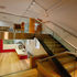 First floor cafe servery, with stairs up to seating area