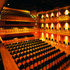 American oak adds a richness to the auditorium, a contrast to the black tweed seating upholstery