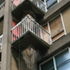 L-shaped balcony protrude round a corner 