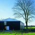 Part of a nearby hedge has been removed so that the barn is more clearly read as ‘a building in a field’ 
