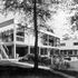 View from the south-west showing the large windows of the dining-room opening on to the balcony and stairs to the garden
