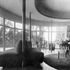 Living room with walnut panelling and flooring and columns sheathed with polished copper. The interior furnishings were designed by the architect in collaboration with Christopher Tunnard