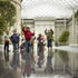 Children play under the glazed roof