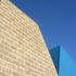 detail of the two towers, one in blockwork the other in blue Sarnafil