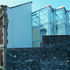 A listed elevation and the rear wall of the glazed facade are seen together from Quarry Street