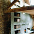 Fire place and bookcase extending over two floors