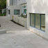 Washed concrete surfaces linking the two extensions