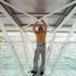 Interchangeable panel being attached from within roof space
