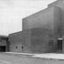 General view of east side showing entrances to administrative offices and staff car parking and exit ramp down from ambulance garage