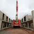 Construction of shell in progress, showing assembly of precast concrete walls, floors and columns