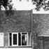 Windowless upper rear wall of three bedroom house