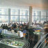 Internal view of curved restaurant looking on to gardens