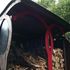 The overhanging curved roof creates a dry loading area for the user.