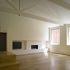 View into living area with exposed trusses