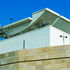 Outer wall in Clashach sandstone, inner core wall in white sand-cement render; roof