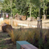 Conjoined logs, timber and pigmented concrete bring together the natural and the artificial
