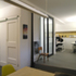 Meeting area, entrance, and desk space. Reclaimed internal timber sliding door in foreground. (Phase I - studio)