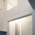 The openings in the existing wall were retained, flooding the kitchen space with an atmospheric light evoking Reilly