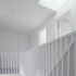 New rooflights and open balustrade allow light down to ground level