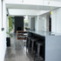 Looking through the kitchen to the dining and living rooms beyond