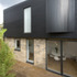 Overall view of the rear showing the new first floor sitting upon the refurbished ground floor