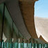 Thatched roof meeting glazed facade