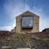 View of large oriel window, cut into the existing barn, framing landscape views
