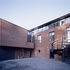 Red-brick facade facing mews