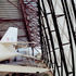 The steel-web roof structure is untreated and rusted