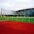 The projecting wing accommodates the 140m sprint track