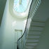 Natural light filters down through the stairwell