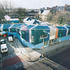 The roof is expressed in a range of blues and greens, giving a significant lift to this section of the street