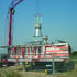 Light towers being craned into place