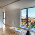 The reconfigured kitchen/living/dining space incorporates space previously given over to an external balcony