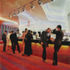 Bar and upper-level foyer have a striking, specially designed carpet by Britons of Kidderminster
