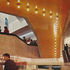 Varnished fair-faced concrete and gloss ceilings provide lively reflective surfaces