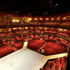 The auditorium seating wraps intimately around the stage