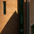 A brick tower for the fire stair signals the stone entrance to the right