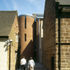 A brick tower for the fire stair signals the stone entrance to the right