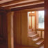 The language of the new work is continued in the timber-framed cottages, where a day-lit stair has been installed