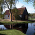 The converted barn and existing pond